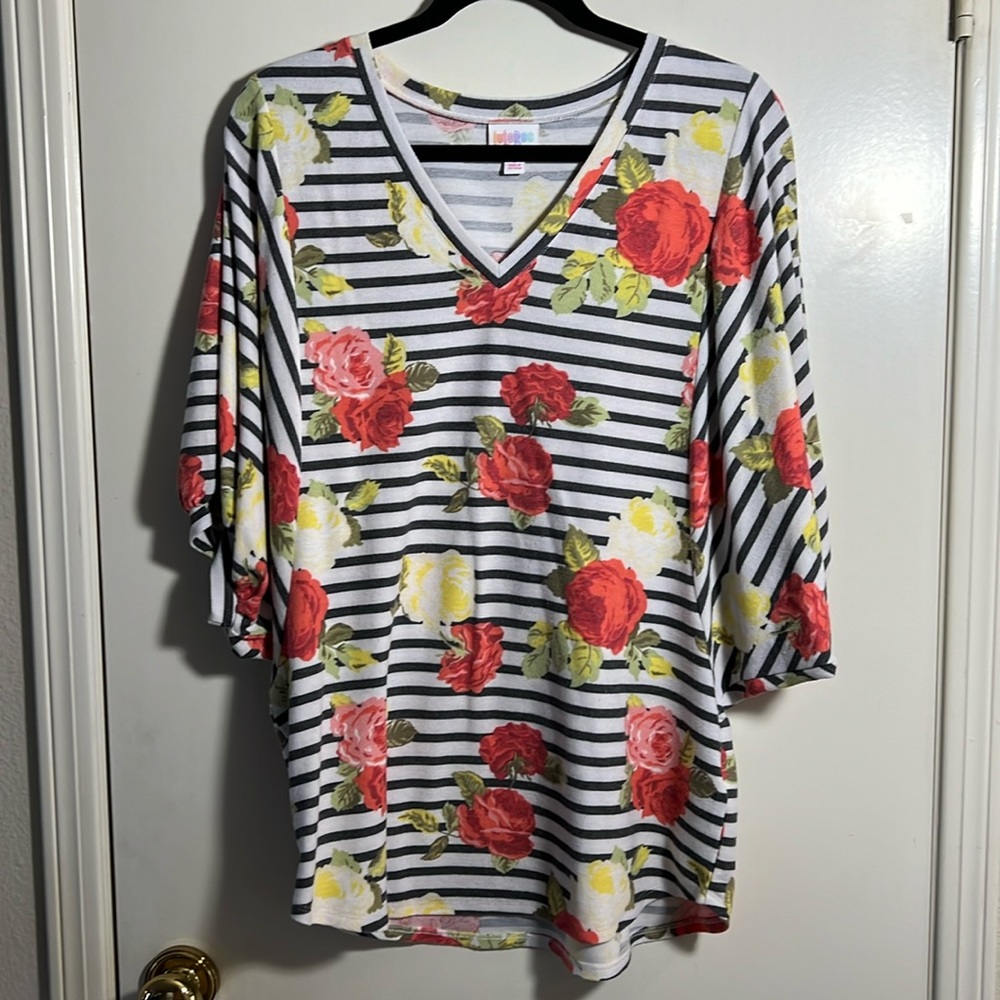 LuLaRoe women’s v-neck floral top with poofy dolman sleeves.